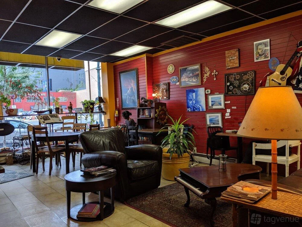 Red walls, armchairs, guitars and window seating inside Zed’s Cafe